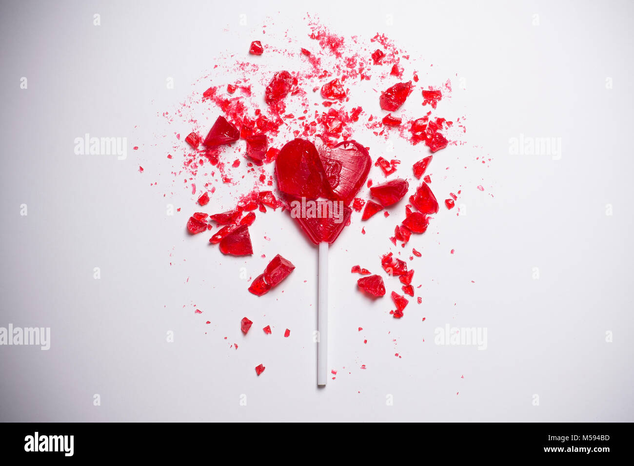 broken heart shaped lollipop Stock Photo