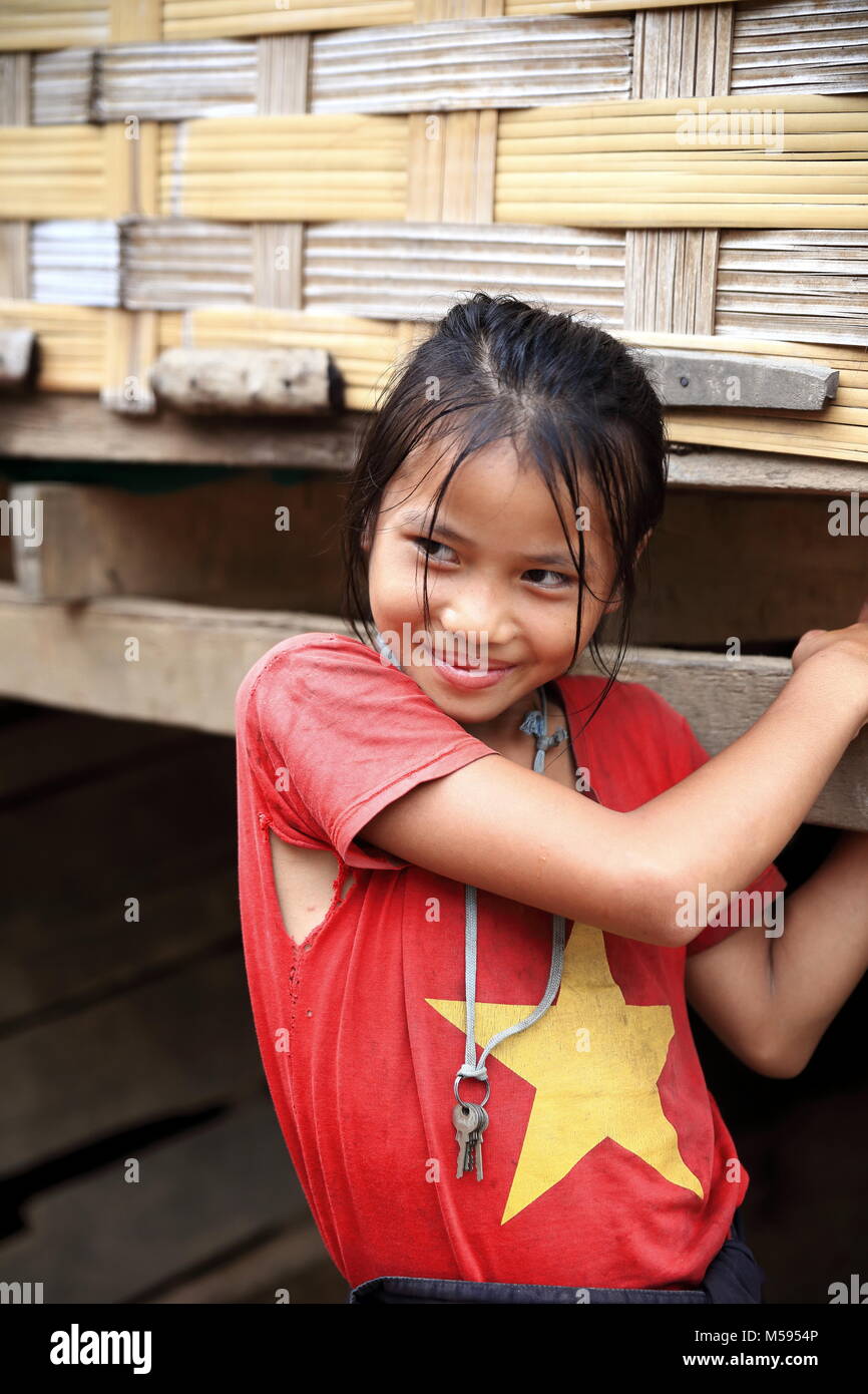 MUANG KHUA,LAOS-OCTOBER 09, 2015:  Students come to receive visits by tourists out of curiosity on October 09, Muang Khua, Laos. Stock Photo