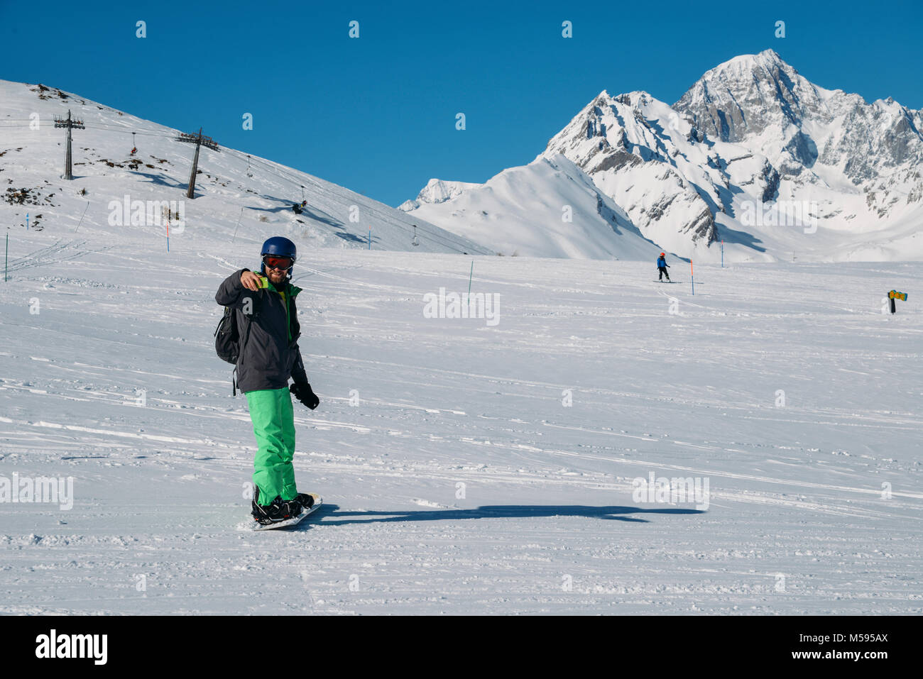 La Thuile, Italy - Feb 18, 2018:  Young snowboarder takes a selfie while going down the piste at La Thuile in Valle d'Aosta, Italy Stock Photo