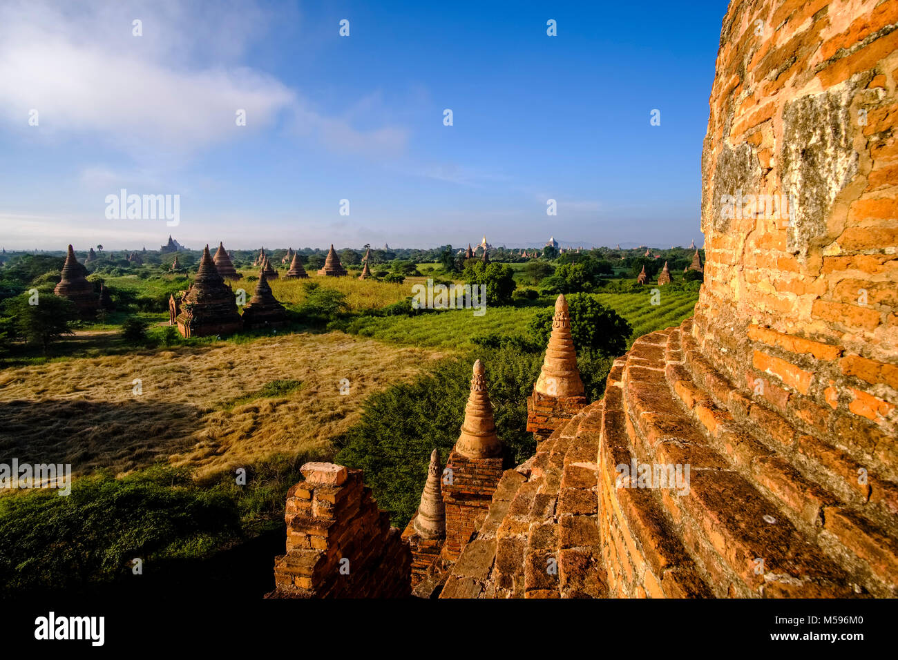 Pagodas of Bagan in the plains of the archaeological site after sunrise, seen from the top of Buledi pagoda Stock Photo