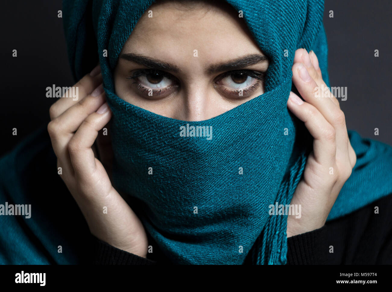 A Muslim girl with beautiful eyes is covered with a hijab. Arab ...