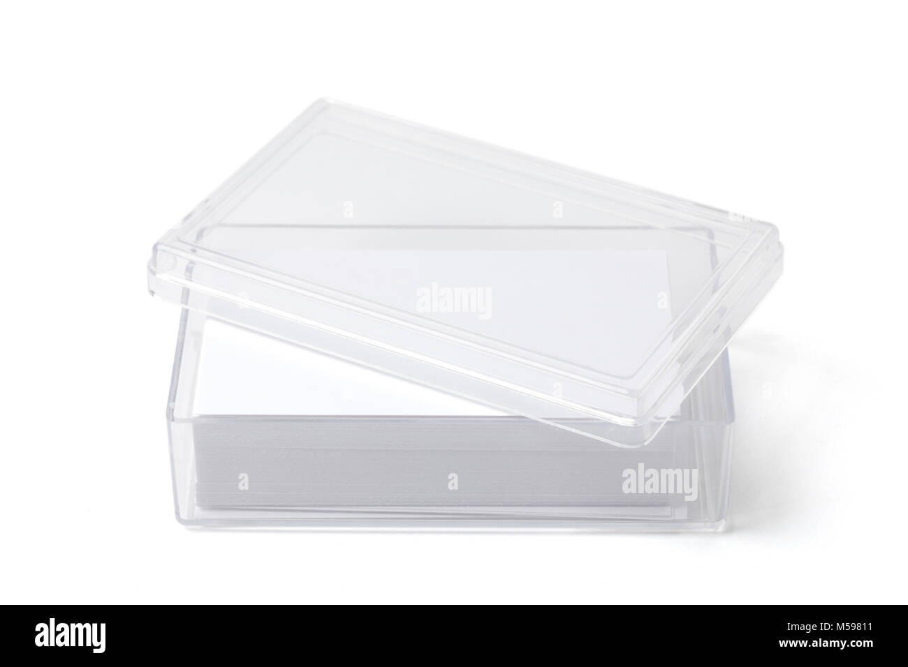 Open transparent plastic box holder with blank visit cards on white. Stock Photo