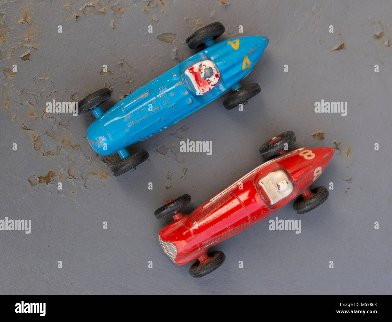 Talbot Lago and Alfa Romeo vintage Dinky toys on an old rusty metal garden table Stock Photo