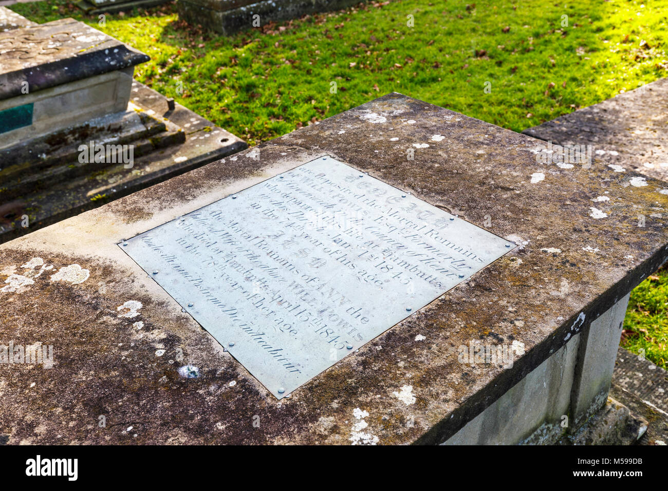 Chest tombs with metallic inscriptions in the churchyard of St Mary's parish church in Painswick, an unspoilt village in the Gloucestershire Cotswolds Stock Photo
