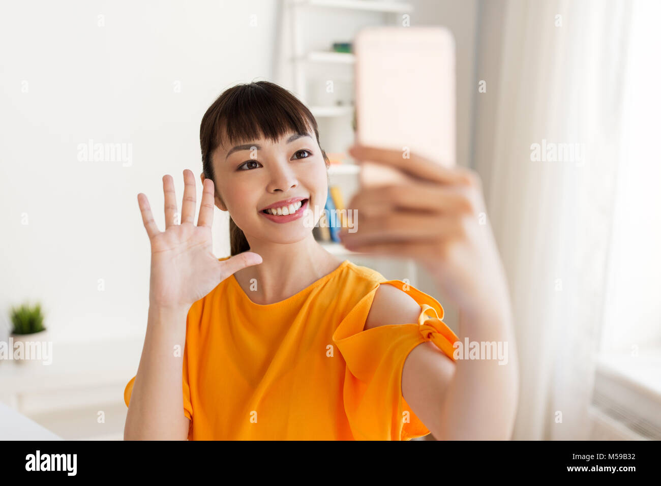 happy asian woman taking selfie by smartphone Stock Photo - Alamy