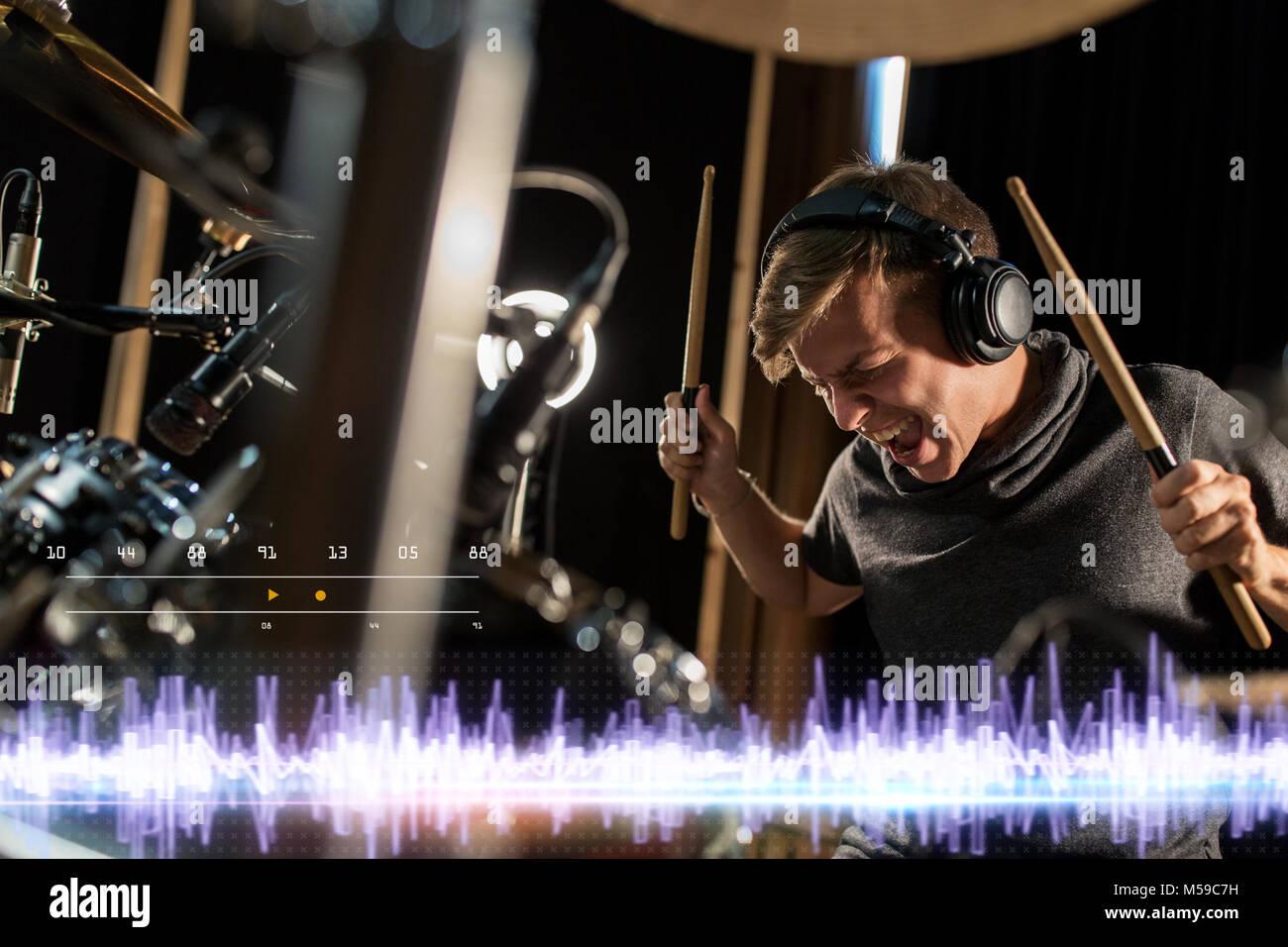 musician playing drums at sound recording studio Stock Photo - Alamy