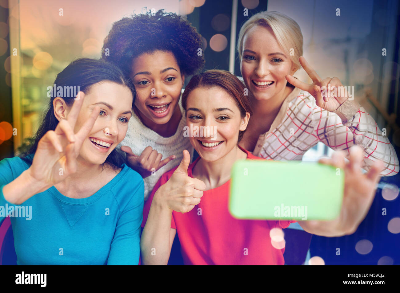 happy young women taking selfie with smartphone Stock Photo - Alamy