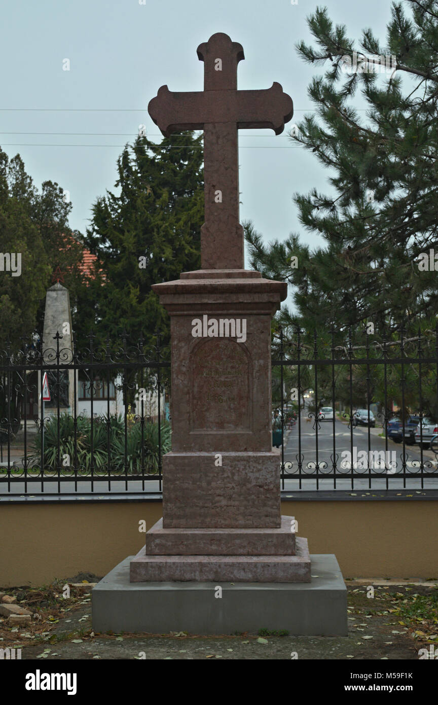 Cross monument in church yard in Kac, Serbia Stock Photo