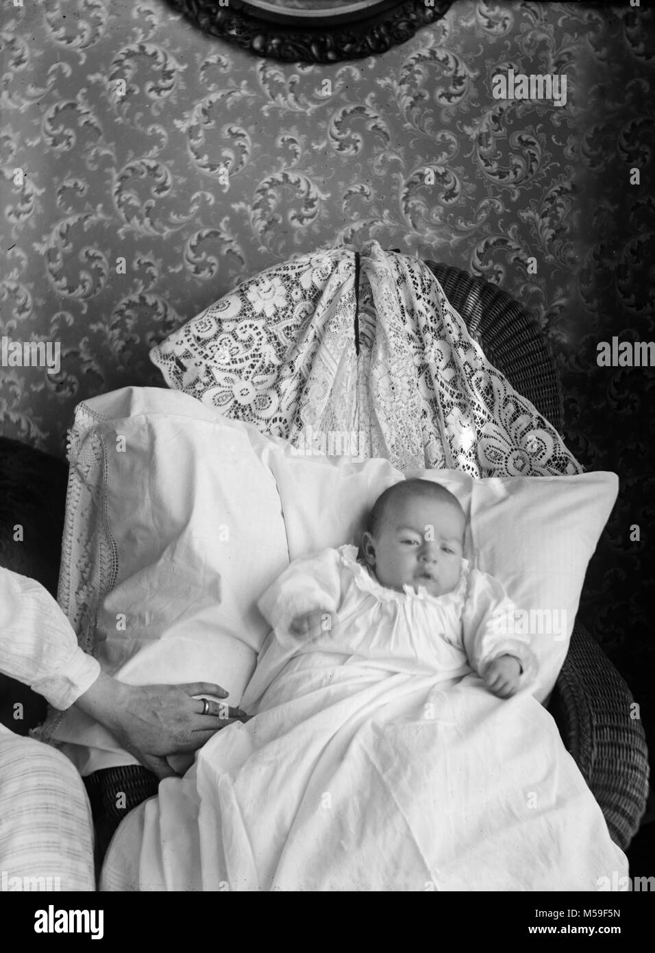 Infant in a christening gown portait, ca. 1905 Stock Photo Alamy