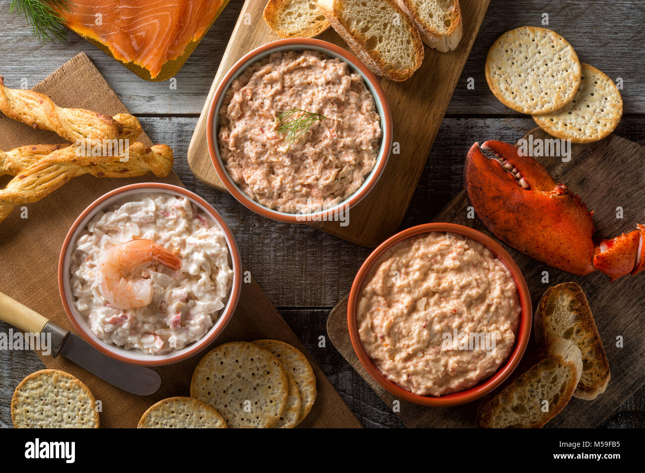 An assortment of delicious seafood dips including lobster dip, smokeds