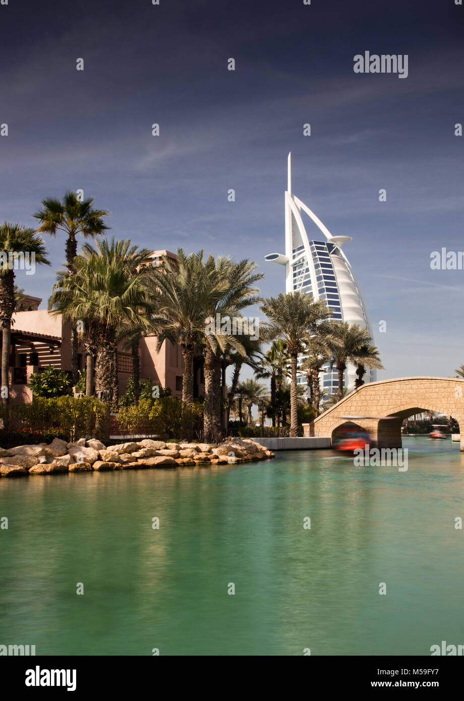 DUBAI, UAE - FEBRUARY, 2018: View on Burj Al Arab, the world only seven stars fotel seen from Madinat Jumeirah. Madinat is a luxury resort which inclu Stock Photo