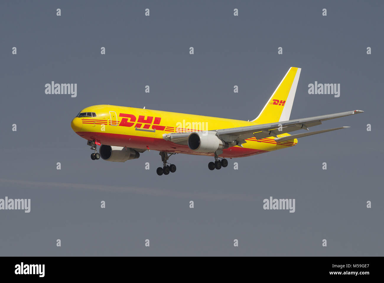 Image of a DHL Boeing 767 shown approaching the Los Angeles International Airport, LAX, for landing. Stock Photo