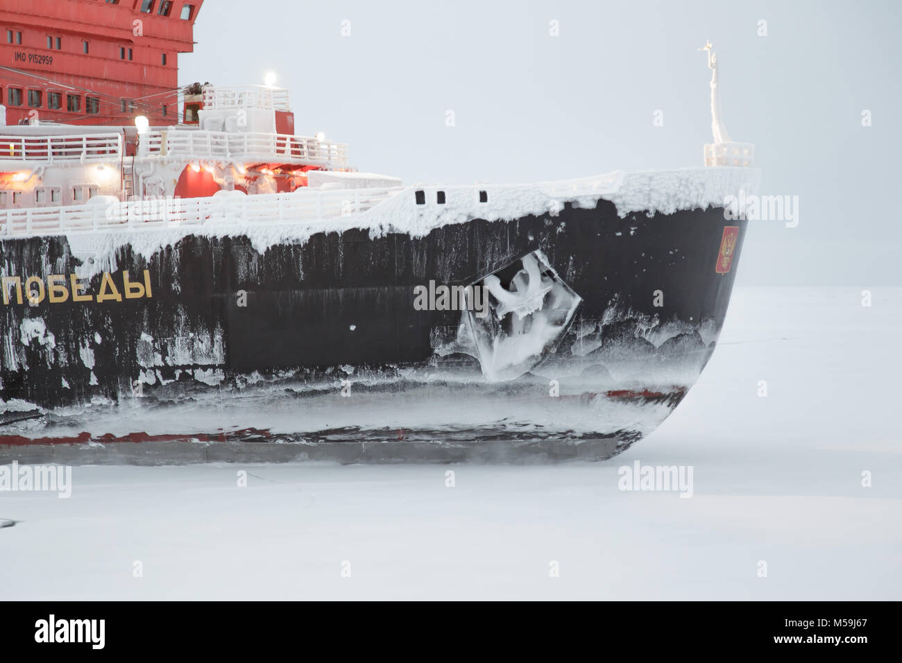 Pevek, Chukchi region, Russia - Pevek, November 30th, 2017: Ice breaker '50 years of the Victory', a forward part of a vessel in ice conditions. Stock Photo