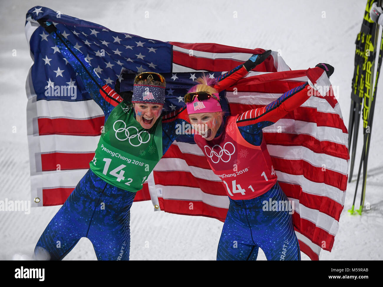Pyeongchang, South Korea. 21st Feb, 2018. Kikkan Randall (R) and