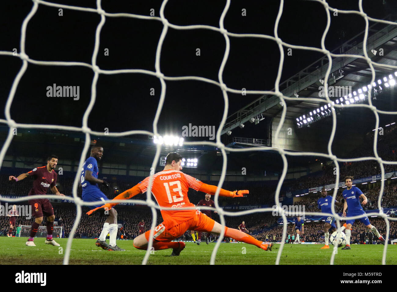 London, UK. 20th February, 2018. Lionel Messi of Barcelona scores the equalising goal past Thibaut Courtois of Chelsea, making it 1-1- Chelsea v Barcelona, UEFA Champions League, Round of 16, 1st Leg, Stamford Bridge, London - 20th February 2018. Credit: Richard Calver/Alamy Live News Stock Photo