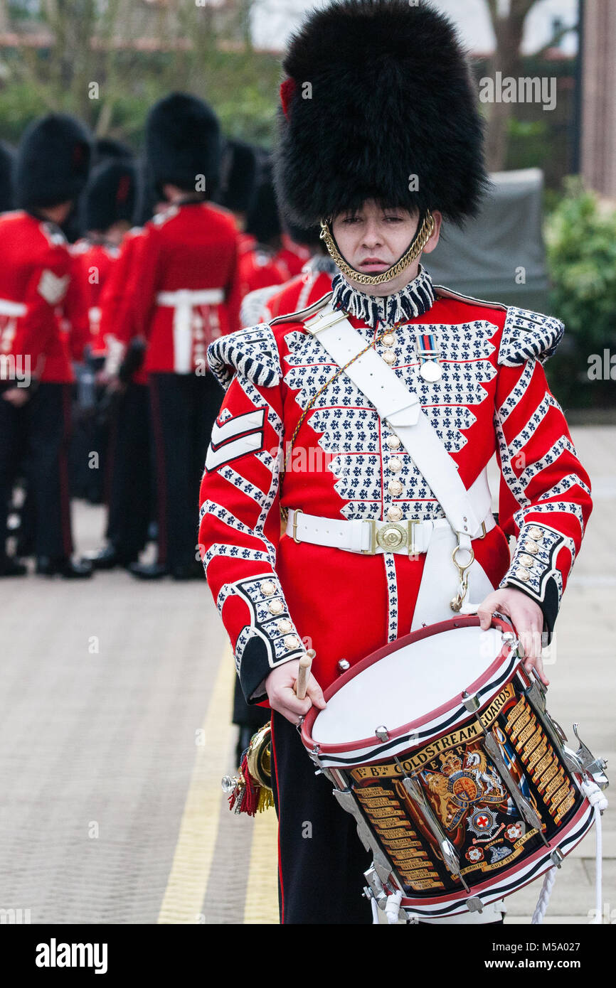Windsor, UK. 21st February, 2018. A member of the Drum Corps Coldstream Guards prepares to attend the Major General's Inspection of the 1st Battalion Coldstream Guards, chosen to Troop its Colour for the Queen’s Birthday Parade on 9th June. Soldiers are tested on military knowledge, history, values and standards and their uniforms, presentation and drill are minutely examined. Credit: Mark Kerrison/Alamy Live News Stock Photo