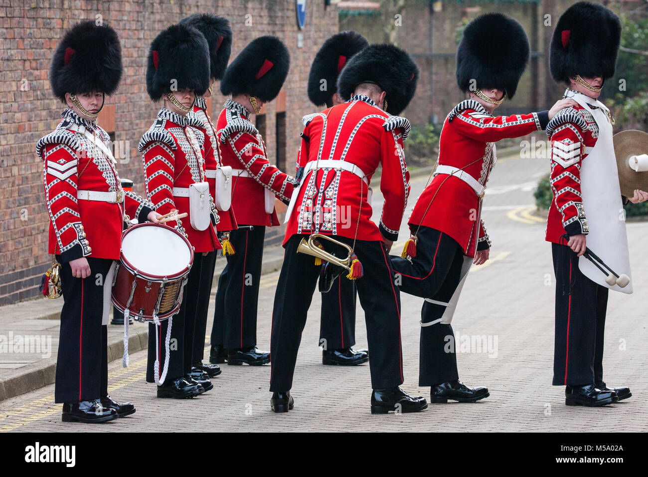 Windsor, UK. 21st February, 2018. Members of the Drum Corps Coldstream Guards prepare to attend the Major General's Inspection of the 1st Battalion Coldstream Guards, chosen to Troop its Colour for the Queen’s Birthday Parade on 9th June. Soldiers are tested on military knowledge, history, values and standards and their uniforms, presentation and drill are minutely examined. Credit: Mark Kerrison/Alamy Live News Stock Photo