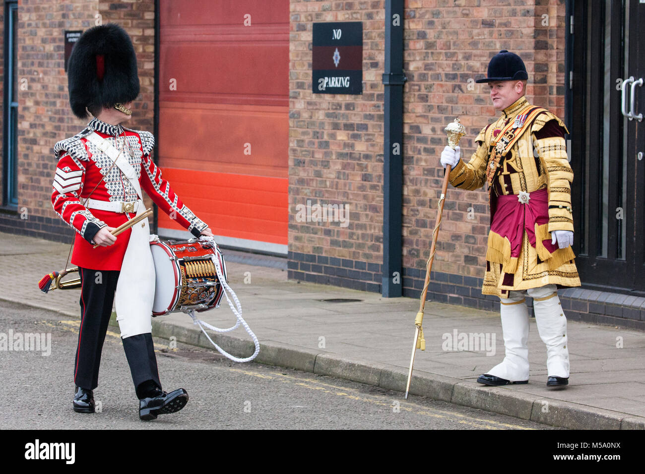 Windsor, UK. 21st February, 2018. Drum Major Liam Rowley (r) greets a member of the Drum Corps Coldstream Guards before the Major General's Inspection of the 1st Battalion Coldstream Guards, chosen to Troop its Colour for the Queen’s Birthday Parade on 9th June. Soldiers are tested on military knowledge, history, values and standards and their uniforms, presentation and drill are minutely examined. Credit: Mark Kerrison/Alamy Live News Stock Photo