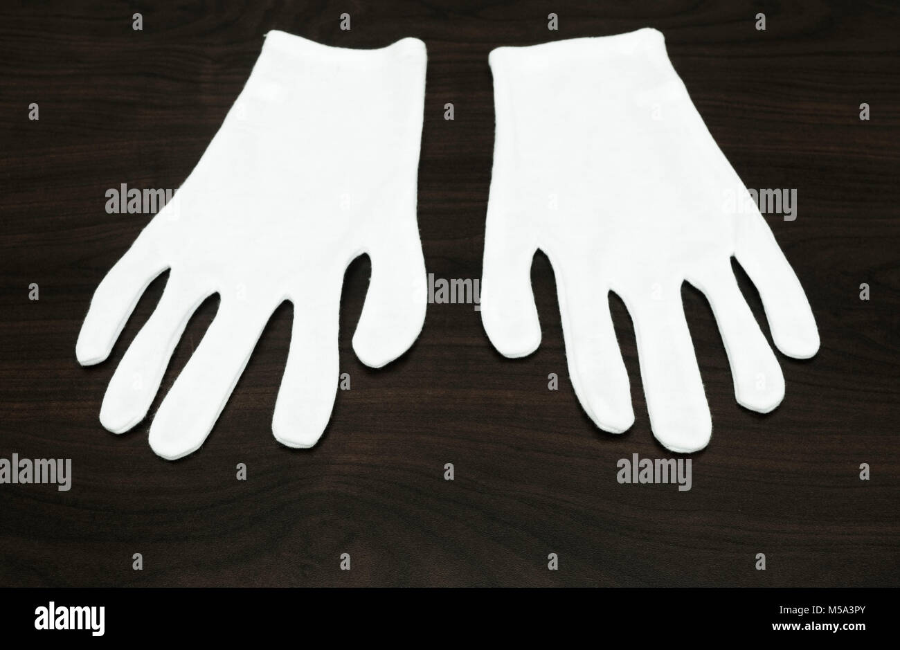 a pair of white cotton gloves Stock Photo Alamy