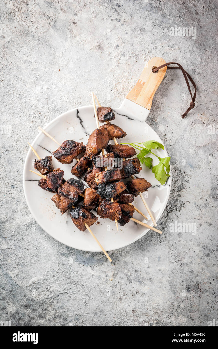 Grilled beef liver on skewers, with teriyaki or soy sauce, yakitori