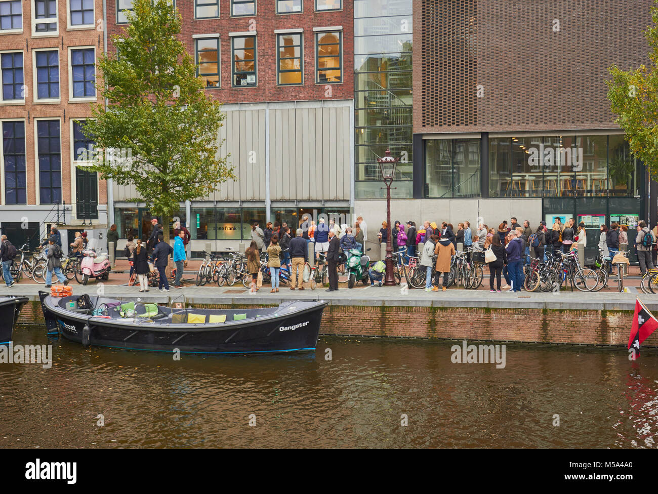 Tourists queuieing outside the Anne Frank House, Prinsengracht, Amsterdam, Netherlands Stock Photo
