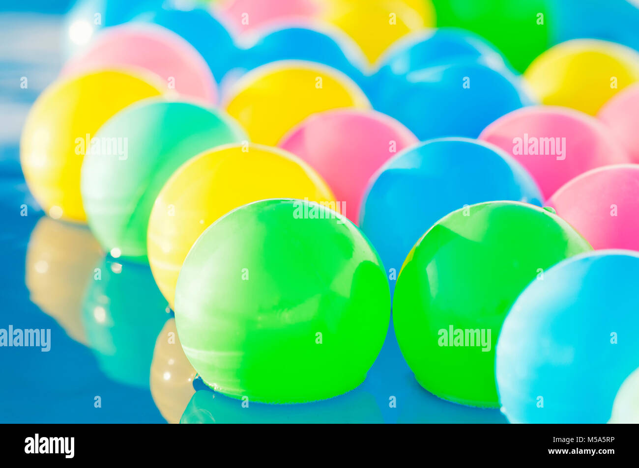 Multicolored plastic balls float in the children's pool Stock Photo Alamy