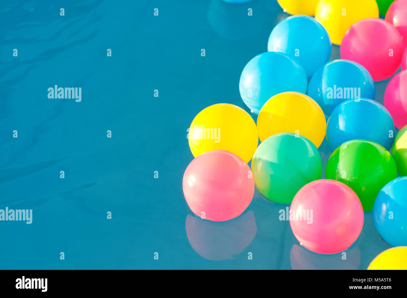 Multicolored plastic balls float in the children's pool Stock Photo Alamy
