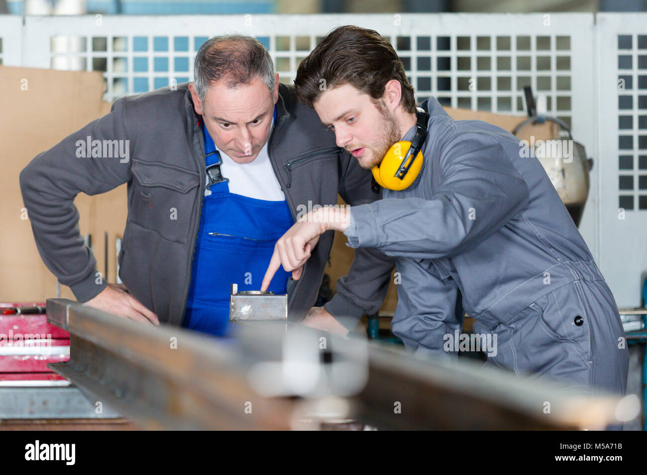 Male apprentice working carpenter in hi-res stock photography and ...