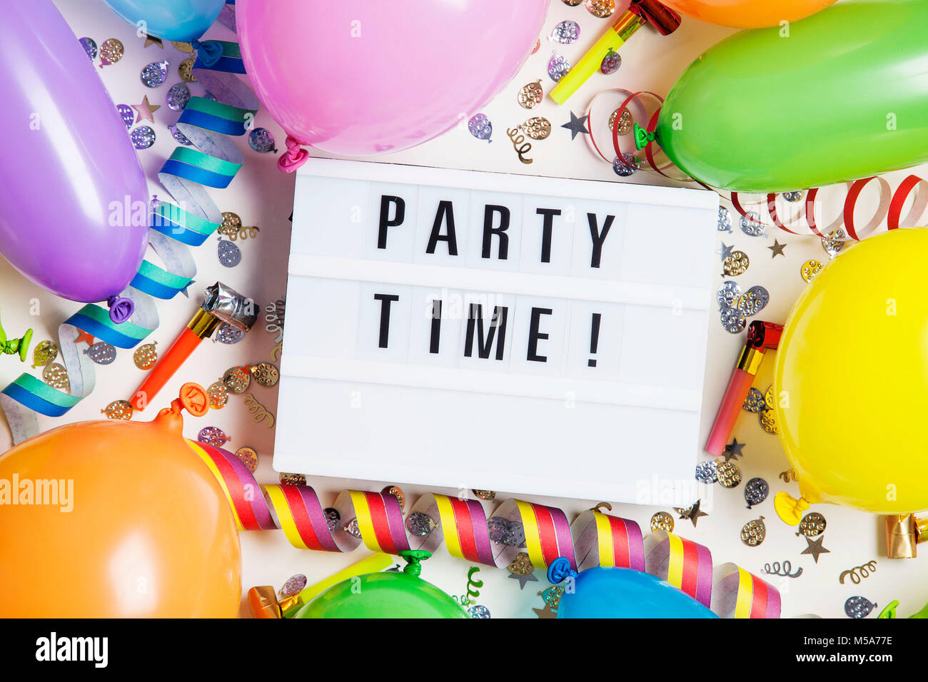 Party celebration background with party time message on a lightbox Stock  Photo - Alamy