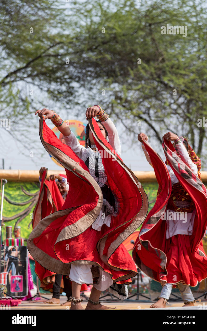 Indian girls performing traditional folk dance on stage Stock Photo