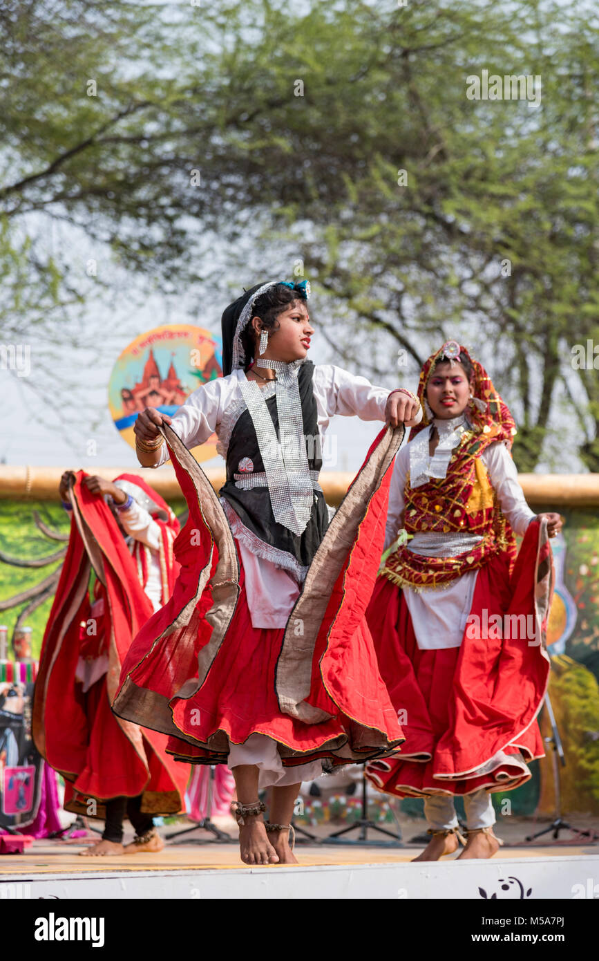 Indian girls performing traditional folk dance on stage Stock Photo