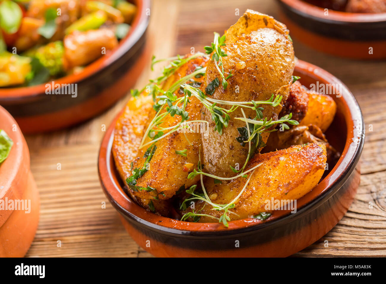 delicious rustic spanish patatas bravas potatoes tapas starter Stock Photo