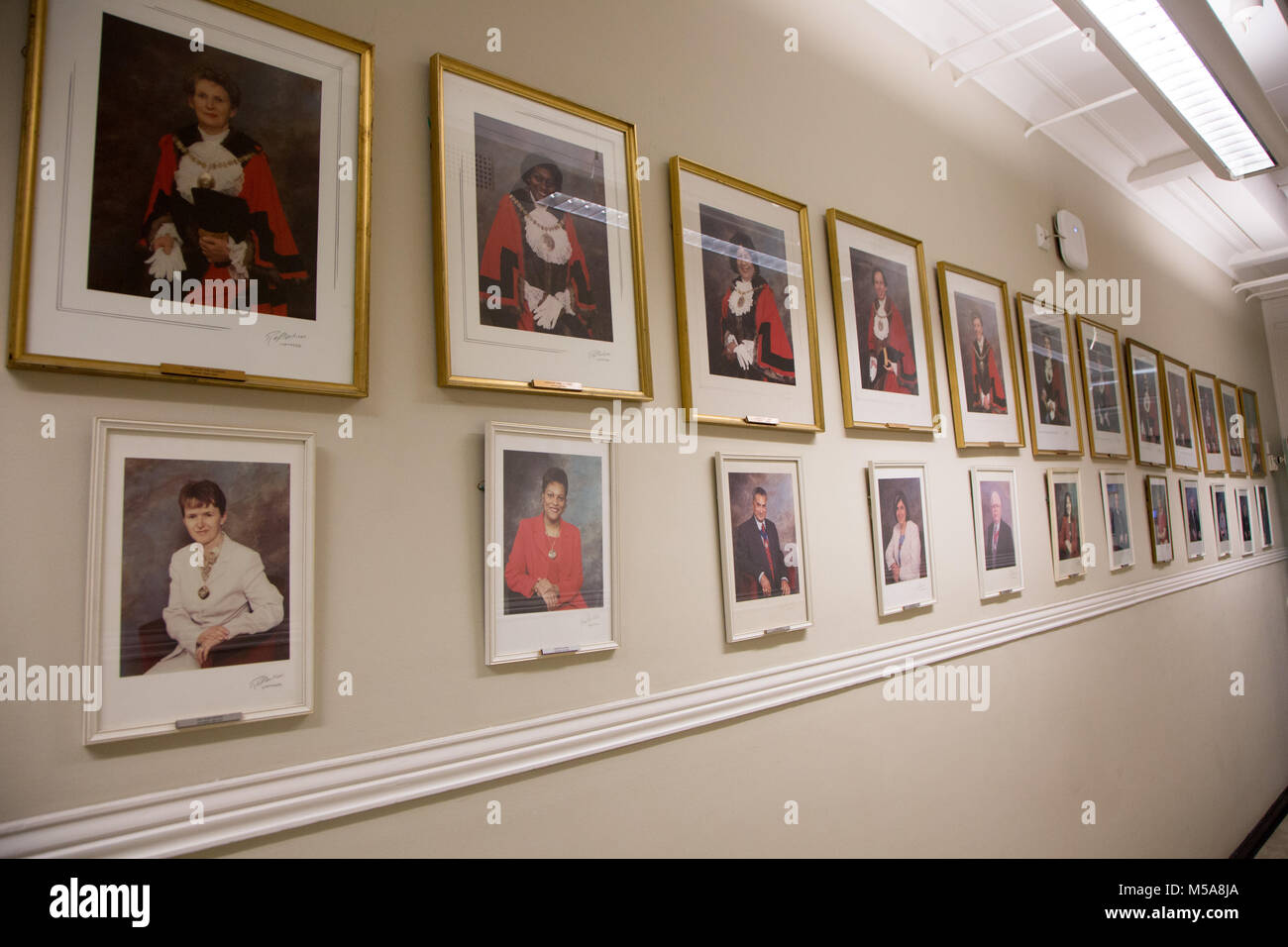A wall a Barnet Town Hall featuring framed photos of past Mayors Stock Photo