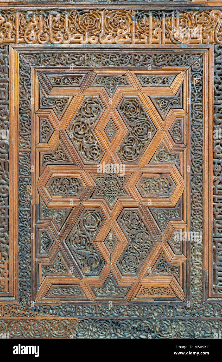 Arabesque floral engraved patterns of wooden ornate door leaf, Cairo, Egypt Stock Photo