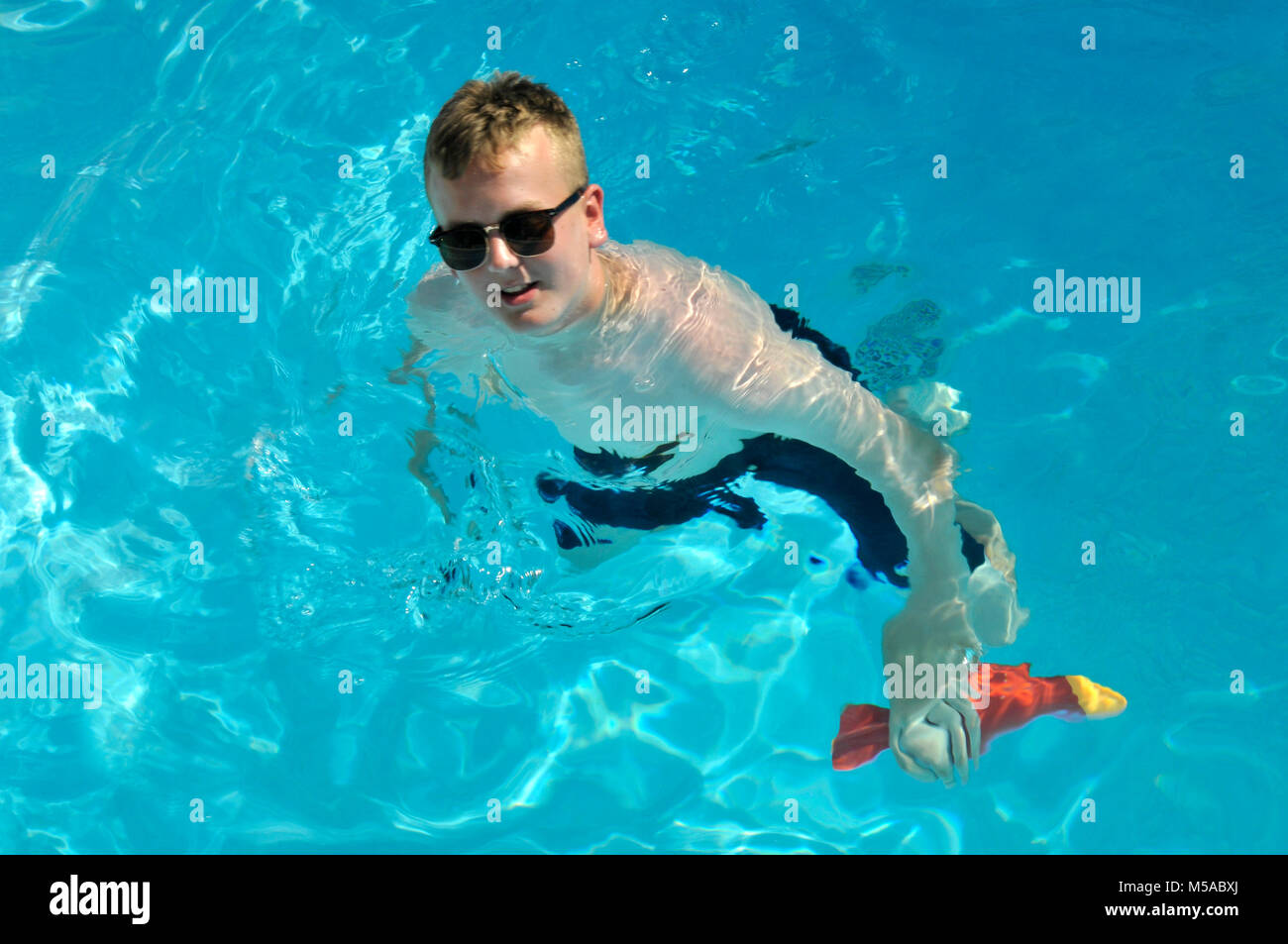 Boy in swimming pool Stock Photo Alamy