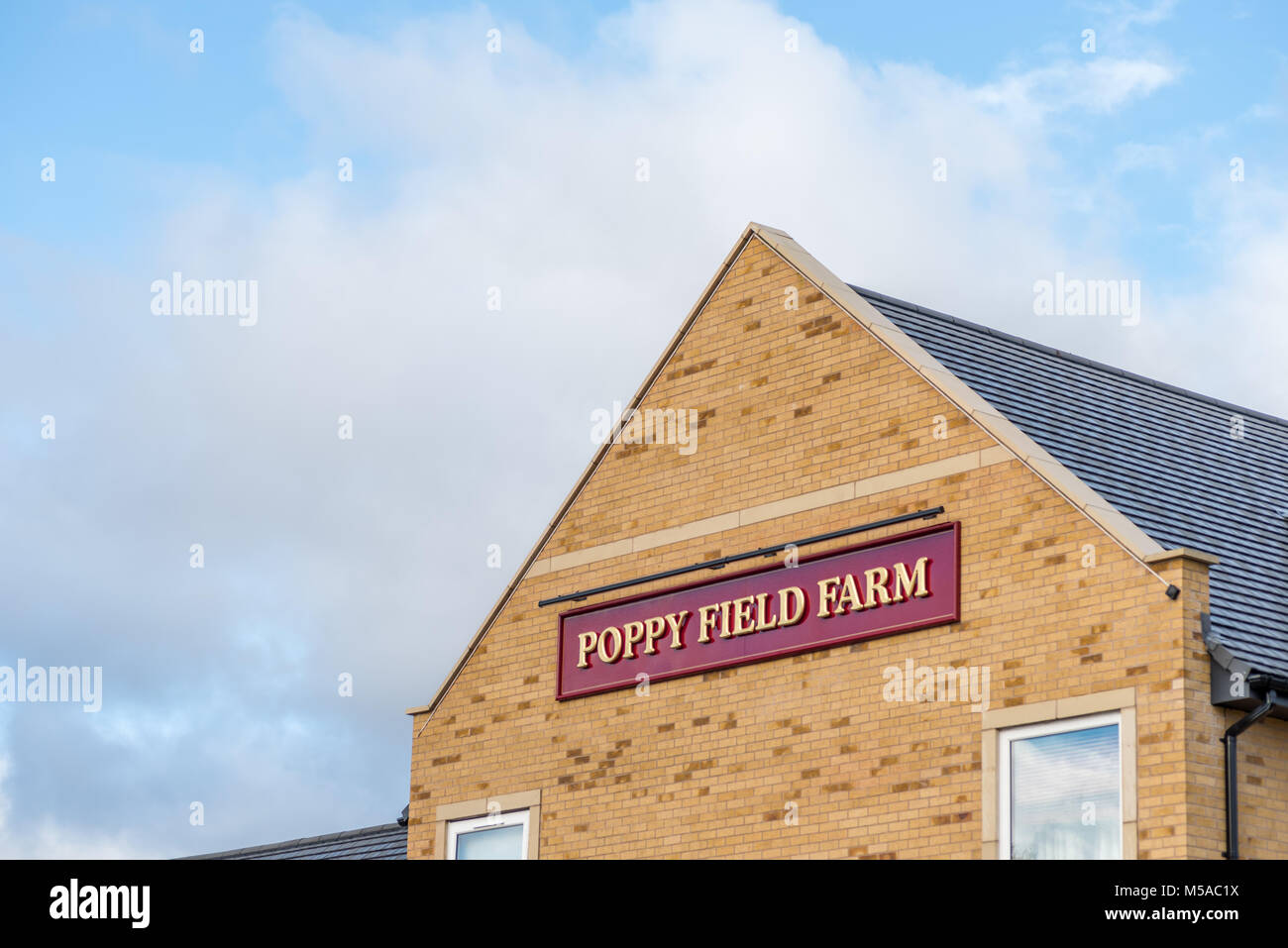 Northampton UK January 15 2018 Poppy Field Farmhouse Inn logo sign post in Duston Stock Photo