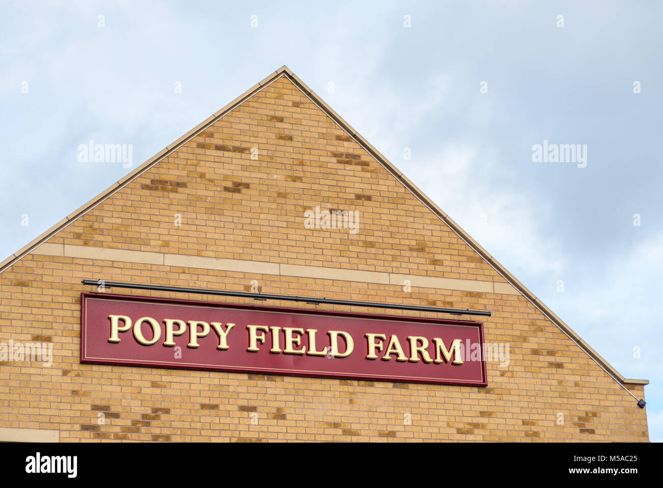 Northampton UK January 15 2018 Poppy Field Farmhouse Inn logo sign post in Duston Stock Photo