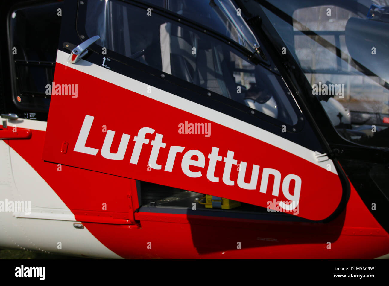 Magdeburg, Germany - 21 February 2018: Door of a helicopter of the German air rescue service with the lettering 'Luftrettung' (air rescue) Stock Photo