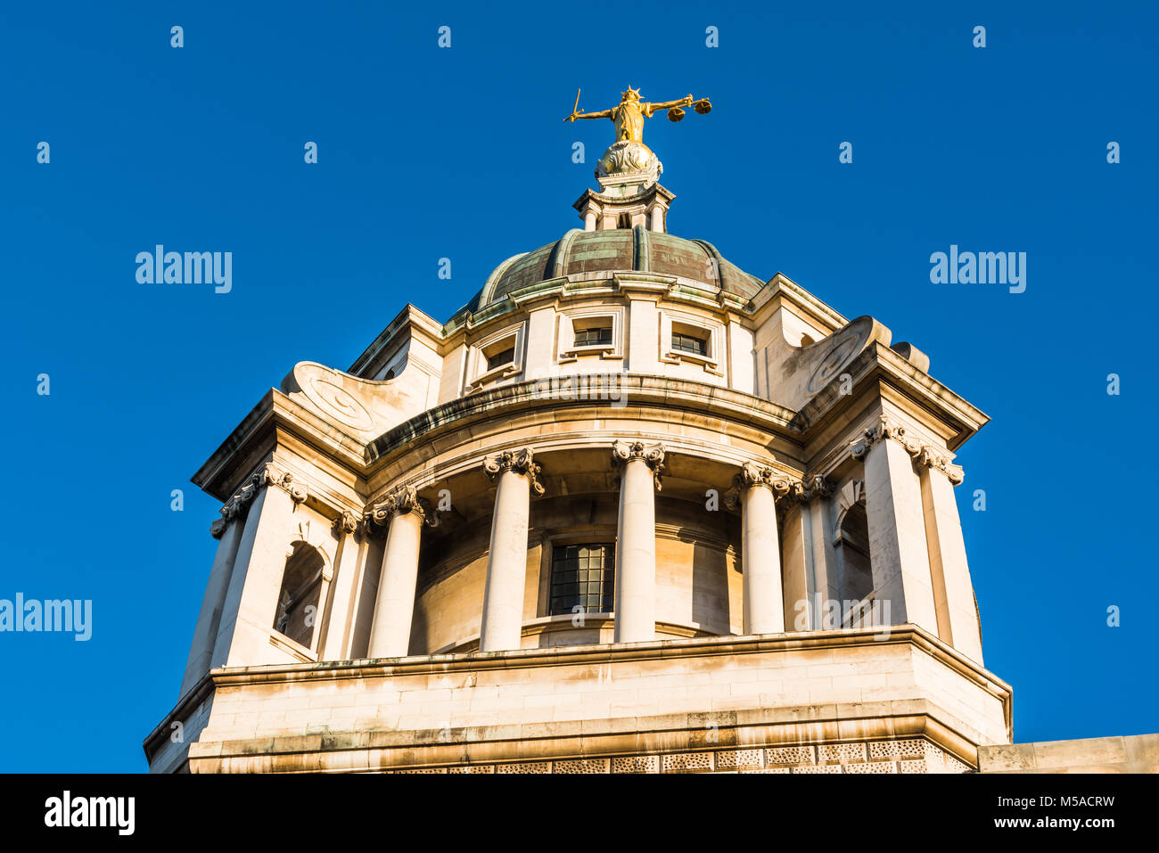The gold leaf statue of Lady Justice on top of The Old Bailey court building, London Stock Photo