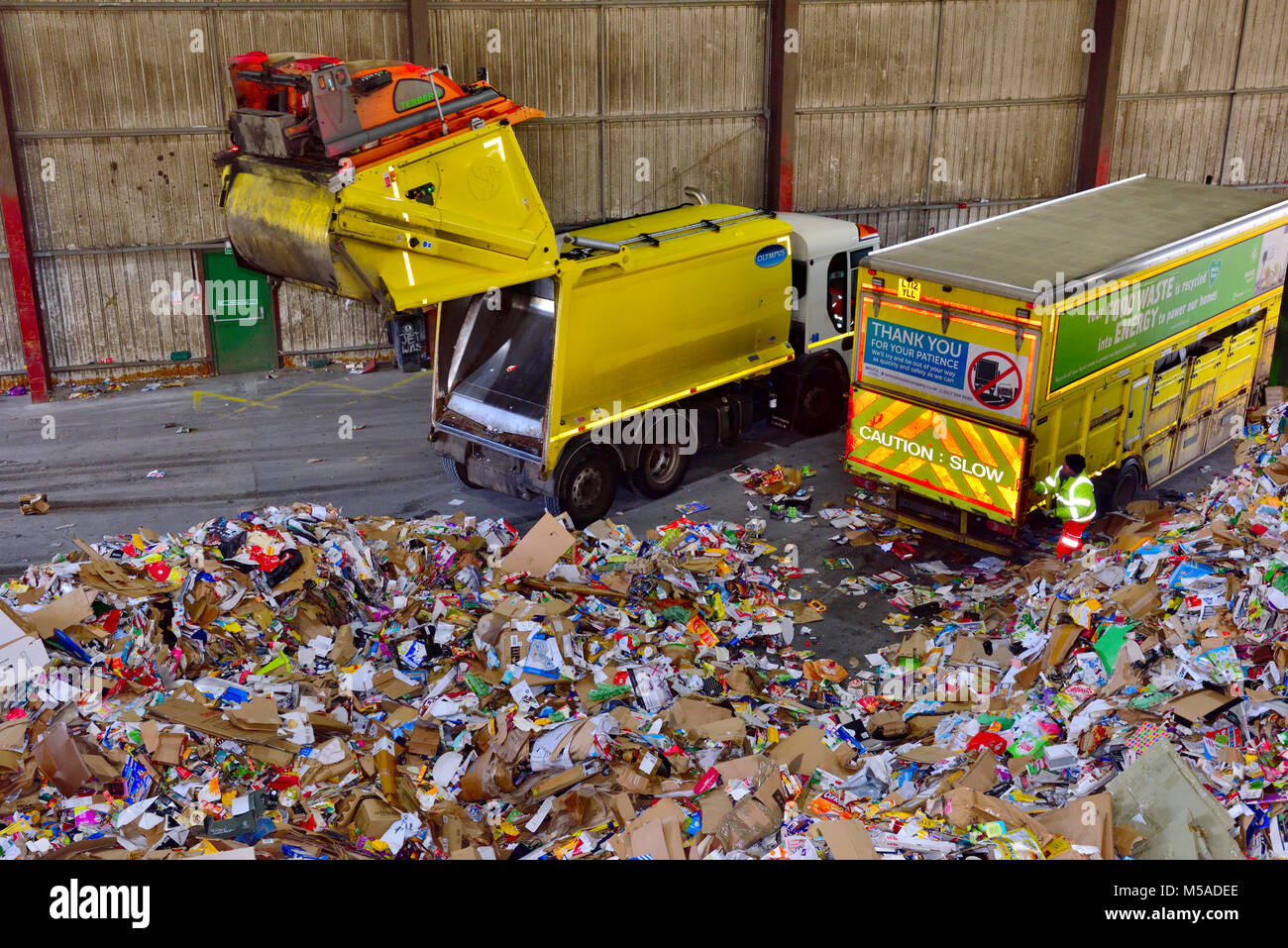 Post consumer waste, paper and cardboard, brought into recycling plant by collection lorry, UK Stock Photo