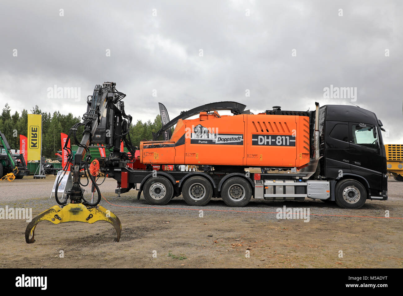 HYVINKAA, FINLAND - SEPTEMBER 15, 2017: Doppstadt DH 811 precision chipper with grapples mounted on Volvo FH16 750 truck on Maxpo 2017. Stock Photo