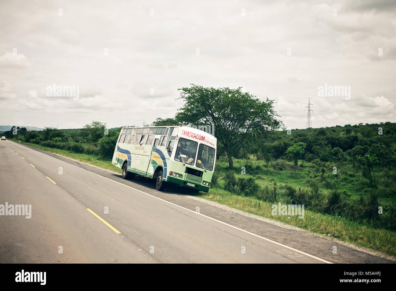 Uganda - September 19, 2011: A bus standing on the road from Kampala to Kabale. Stock Photo