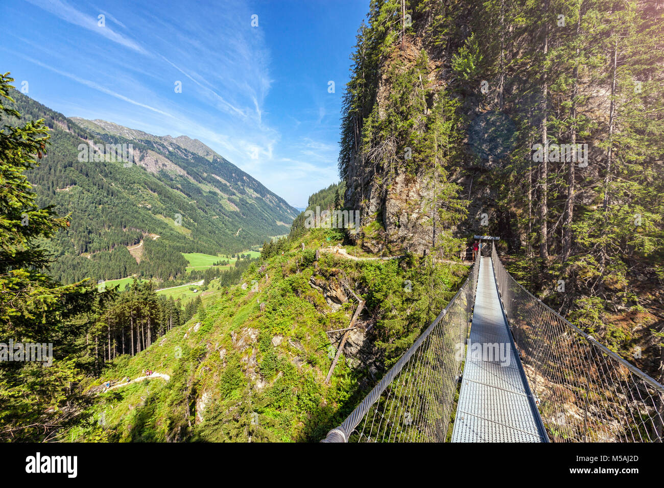 Swing bridge over the Riesach waterfall at Rohrmoos Untertal. The waterfall is the highest of Styria Austria Stock Photo