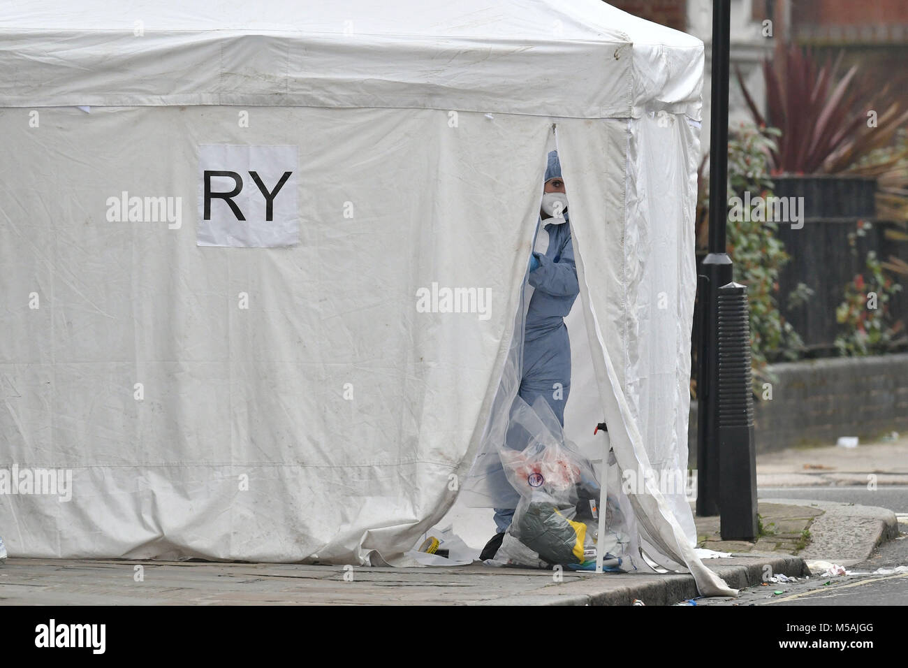 Police forensics officers at the scene in bartholomew road hires stock