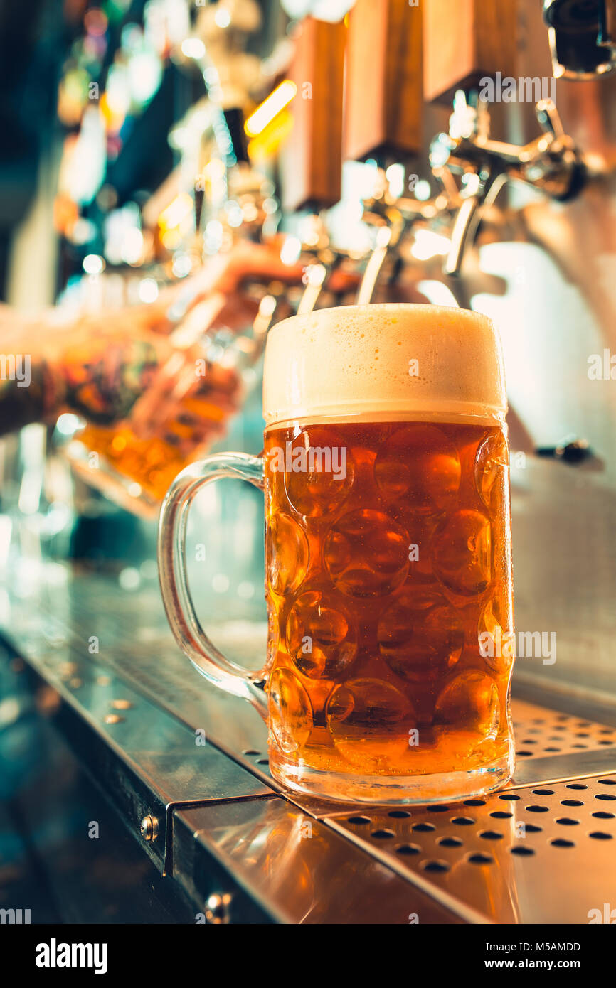 Bartender pouring keg barrel beer hires stock photography and images