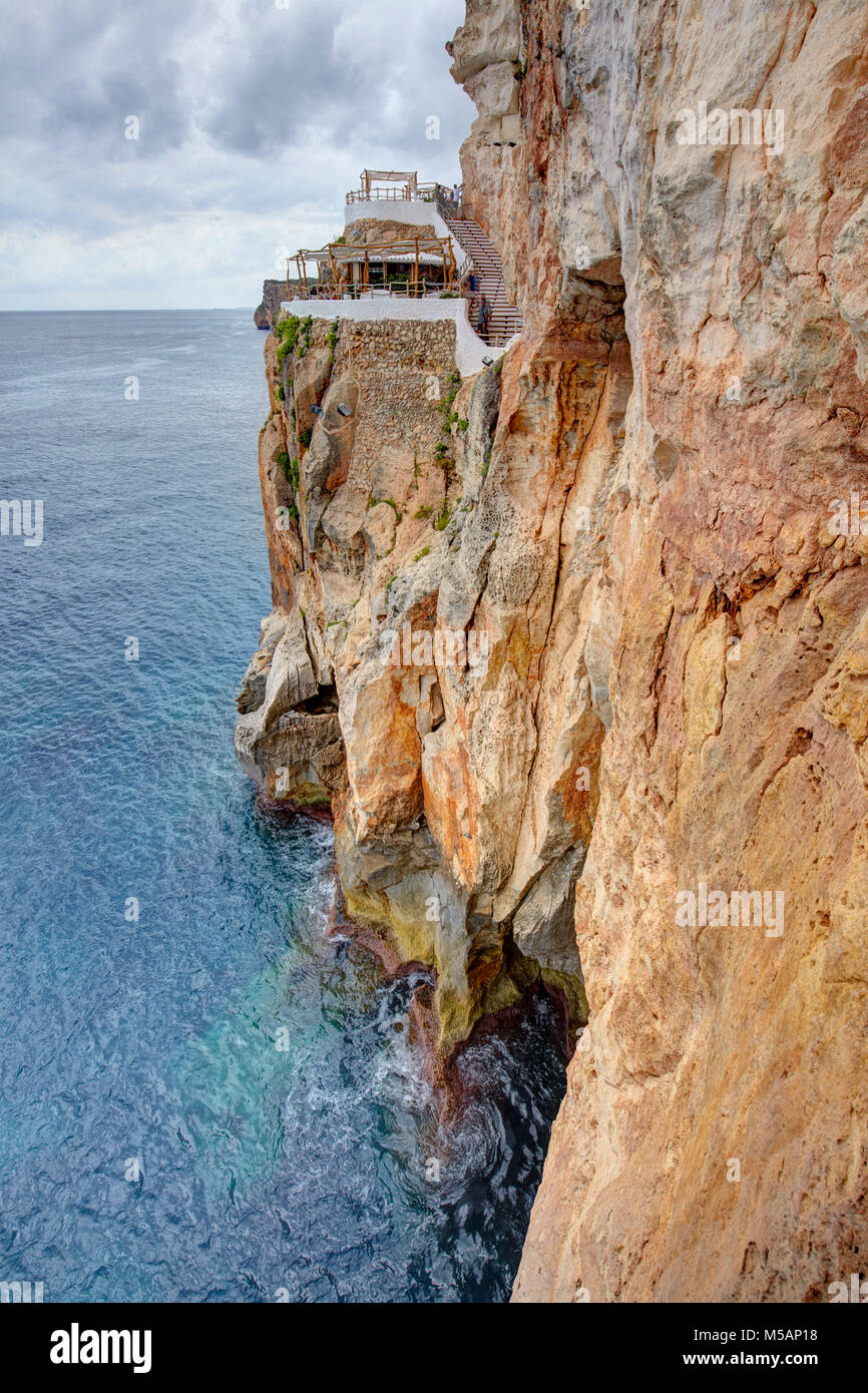 Cova d'en Xoroi bar, situated on a cliff on the south coast of Minorca, Spain Stock Photo