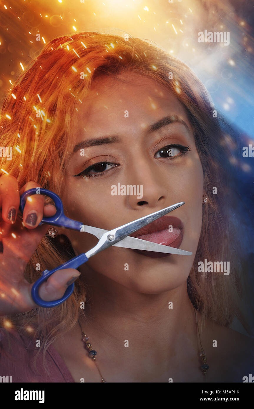 Woman about to cut her tongue with scissors so she wont speak out Stock
