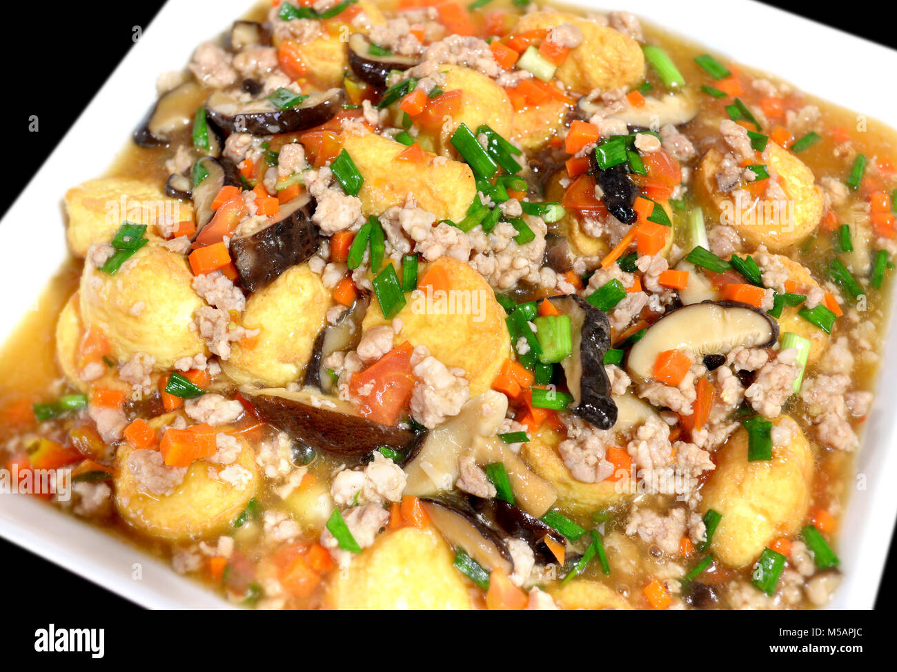 Deep fried tofu with gravy sauce in chinese style photo in flash lighting Stock Photo Alamy
