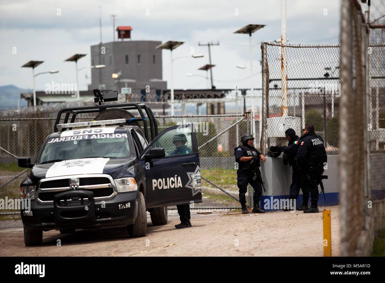 Federal Police and other authorities exit the Altiplano maximum-security prison near Toluca, Mexico on Sunday, July 12, 2015. The notorious cartel leader Joaquin 'El Chapo' Guzman escaped from this high security prison the night before, the second time he has escaped a Mexican prison. Stock Photo