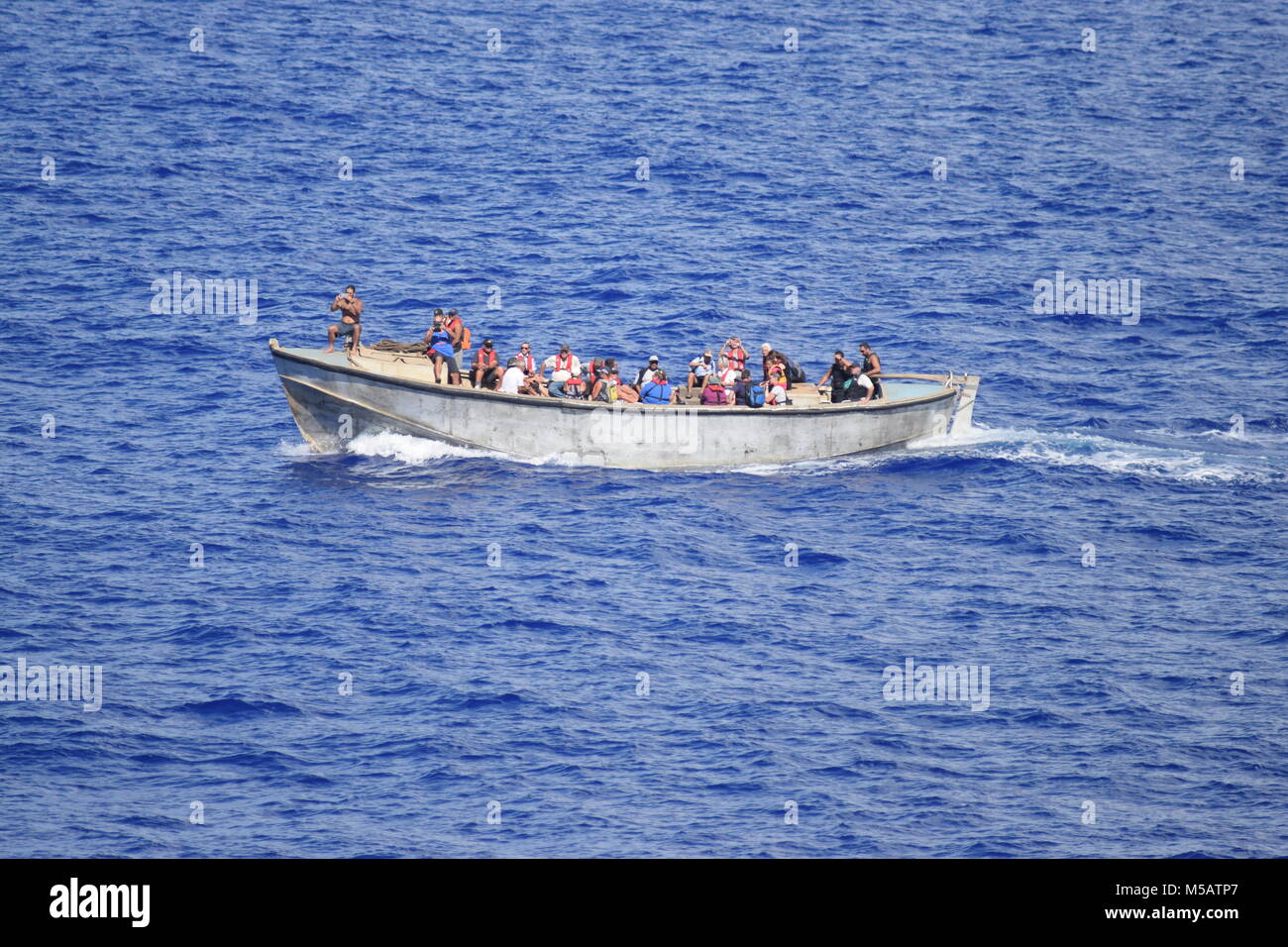 Pitcairn Islanders sailing to board Black Watch Stock Photo